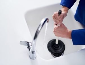 someone drain cleaning